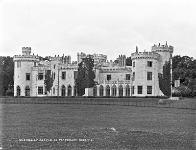 **View of Shanbally Castle across the southern gardens. Main Library is visible in centre of facade with single storey conservatory to the right**